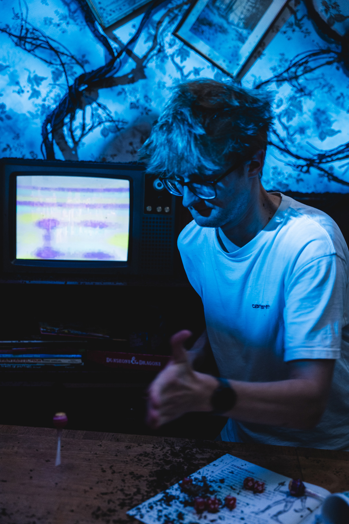 Spinning a lollipop in front of the TV on set