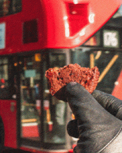 Animated launch graphic: a Drooly cake held up in front of a London bus