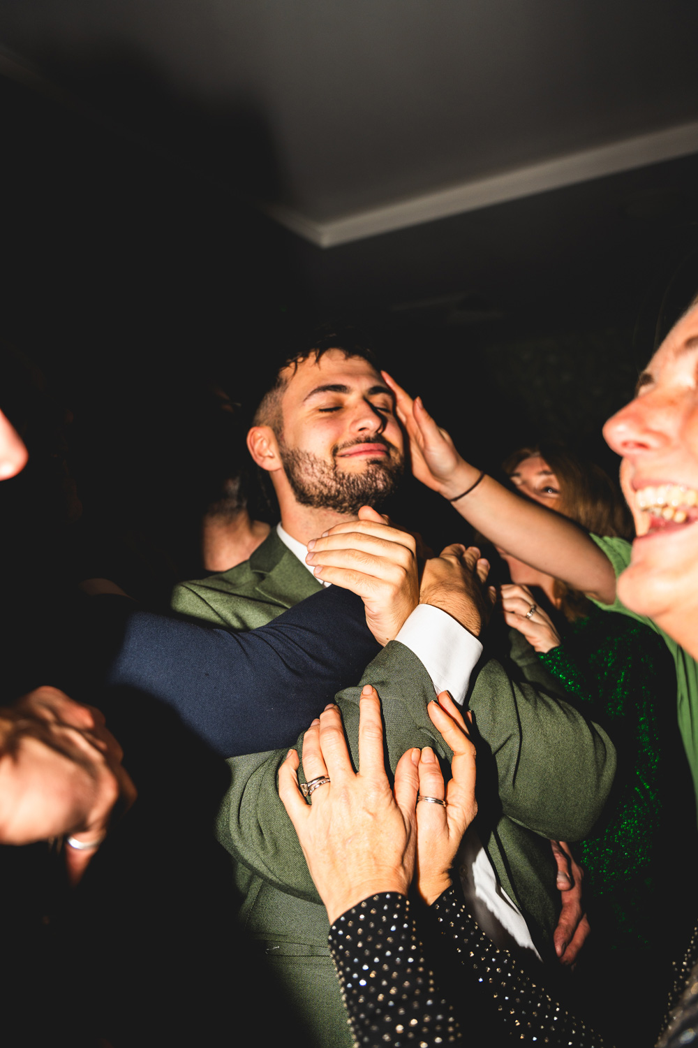 Christmas party, someone's face being grabbed mid-laugh