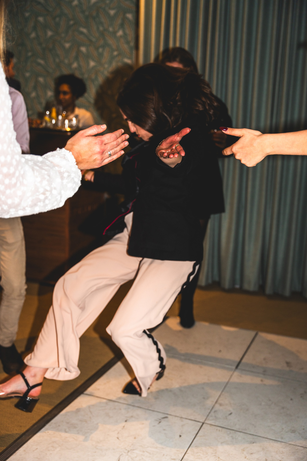 Motion-blurred shot of people dancing at a Christmas party