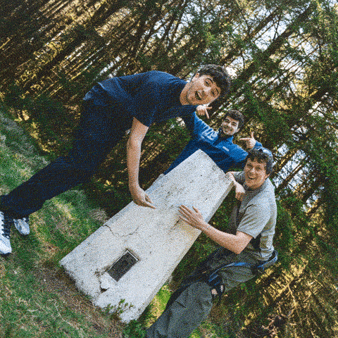The lads mucking about at the trig point